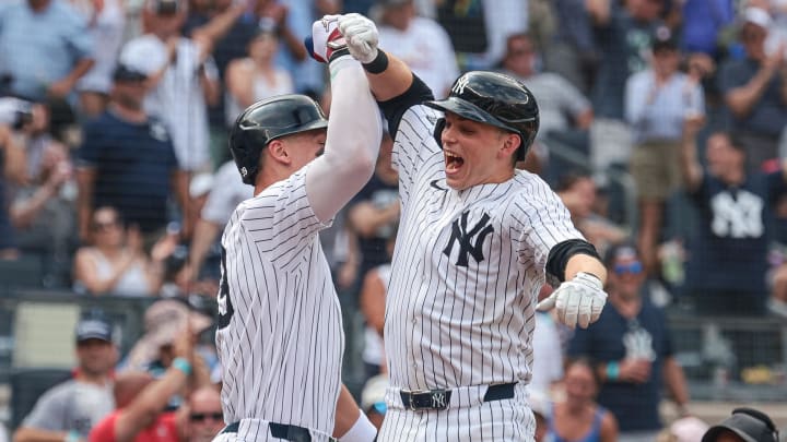 Jul 6, 2024; Bronx, New York, USA; New York Yankees first baseman Ben Rice (93) celebrates after his third home run of the game, a three run home run, with center fielder Aaron Judge (99) during the seventh inning against the Boston Red Sox at Yankee Stadium.