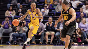Mar 9, 2024; Baton Rouge, Louisiana, USA; LSU Tigers forward Tyrell Ward (15) brings the ball up court against Missouri Tigers guard Nick Honor (10) during the first half at Pete Maravich Assembly Center. Mandatory Credit: Stephen Lew-Imagn Images
