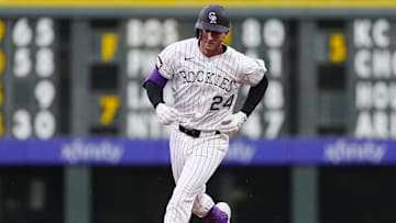 Jul 22, 2025; Denver, Colorado, USA;Colorado Rockies third baseman Ryan McMahon (24) runs off a three run home run in the fourth inning against the St. Louis Cardinals at Coors Field. 