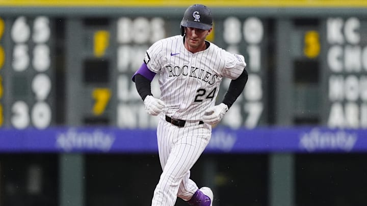 Jul 22, 2025; Denver, Colorado, USA;Colorado Rockies third baseman Ryan McMahon (24) runs off a three run home run in the fourth inning against the St. Louis Cardinals at Coors Field. 