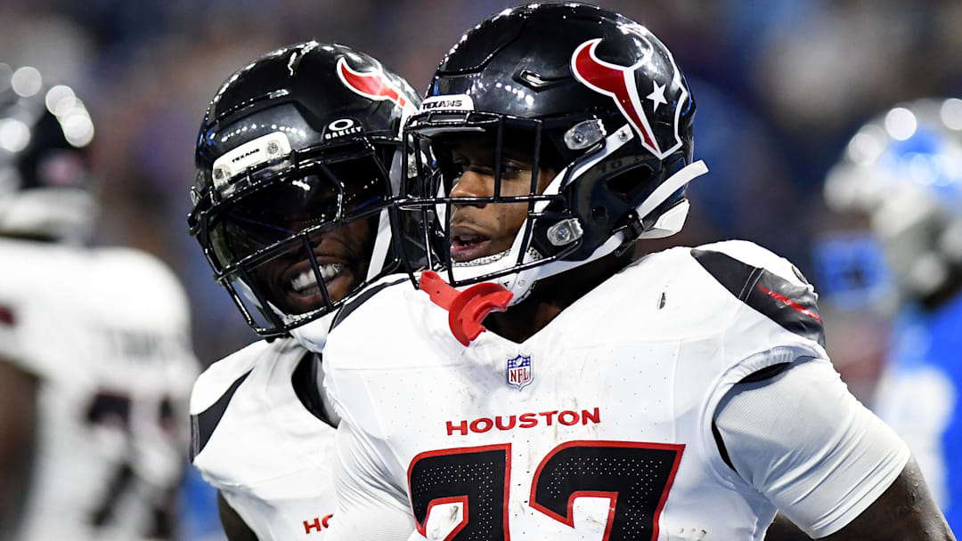 Houston Texans running back Woody Marks (27) celebrates with teammates after scoring a touchdown against the Detroit Lions in the second quarter at Ford Field.