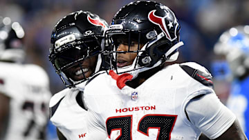 Houston Texans running back Woody Marks (27) celebrates with teammates after scoring a touchdown against the Detroit Lions in the second quarter at Ford Field.