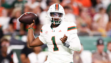 Sep 21, 2024; Tampa, Florida, USA; Miami Hurricanes quarterback Cam Ward (1) drops back to pass against the South Florida Bulls in the second quarter at Raymond James Stadium. Mandatory Credit: Nathan Ray Seebeck-Imagn Images
