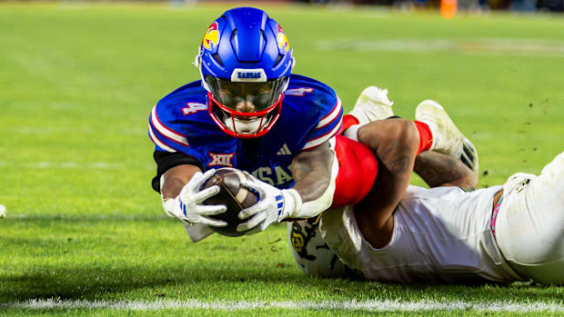 Kansas running back Devin Neal (4) dives into the end zone during the 3rd  quarter between the Kansas Jayhawks and the Colora