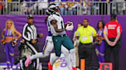 Oct 19, 2025; Minneapolis, Minnesota, USA; Philadelphia Eagles wide receiver A.J. Brown (11) catches a pass for a touchdown during the first half against the Minnesota Vikings at U.S. Bank Stadium. Mandatory Credit: Brad Rempel-Imagn Images