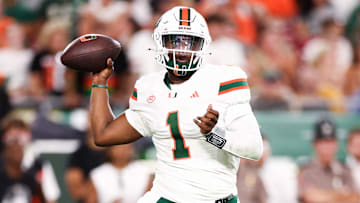 Sep 21, 2024; Tampa, Florida, USA; Miami Hurricanes quarterback Cam Ward (1) drops back to pass against the South Florida Bulls in the second quarter at Raymond James Stadium. Mandatory Credit: Nathan Ray Seebeck-Imagn Images