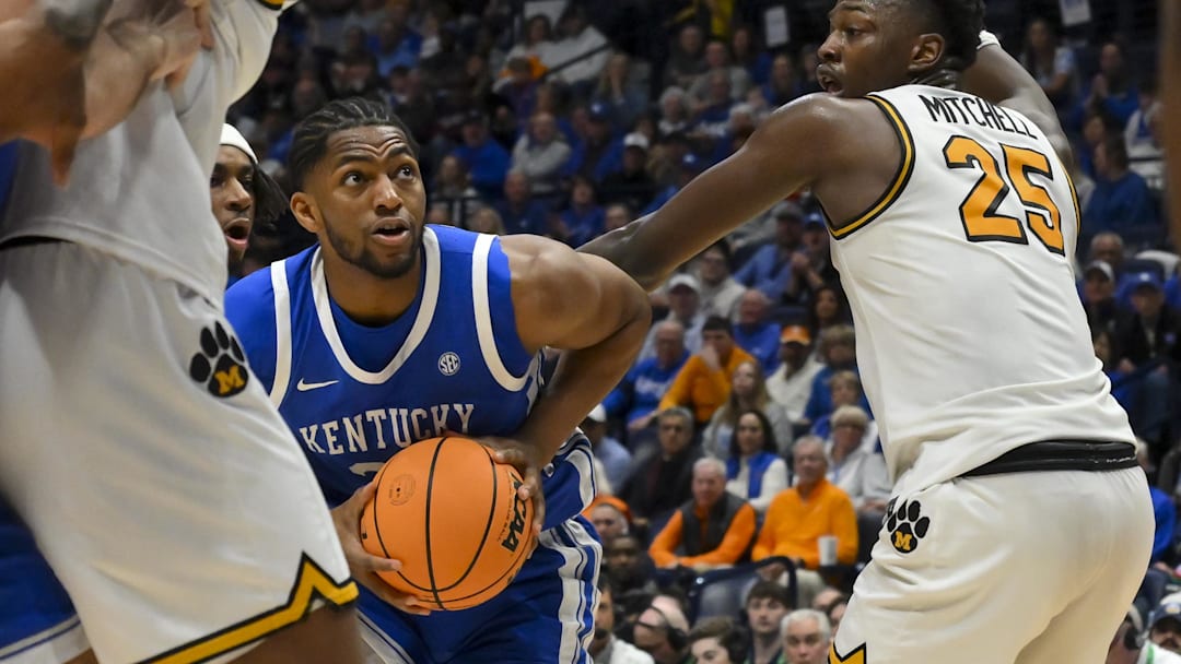 Mar 12, 2026; Nashville, TN, USA;  Kentucky Wildcats forward Mouhamed Dioubate (23) head fakes Missouri Tigers forward Mark Mitchell (25) during the second half at Bridgestone Arena. Mandatory Credit: Steve Roberts-Imagn Images