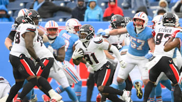 Jan 5, 2025; Nashville, Tennessee, USA;  Houston Texans running back Dameon Pierce (31) runs the ball against the Tennessee Titans during the first half at Nissan Stadium. Mandatory Credit: Steve Roberts-Imagn Images