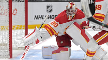 Apr 17, 2025; Los Angeles, California, USA;  Calgary Flames goaltender Dan Vladar (80) makes a save during the second period against the Los Angeles Kings at Crypto.com Arena.