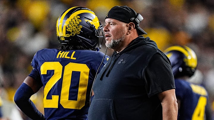 Michigan defensive line coach Lou Esposito talks to players after a play against New Mexicoduring the first half at Michigan Stadium in Ann Arbor on Saturday, August 30, 2025.