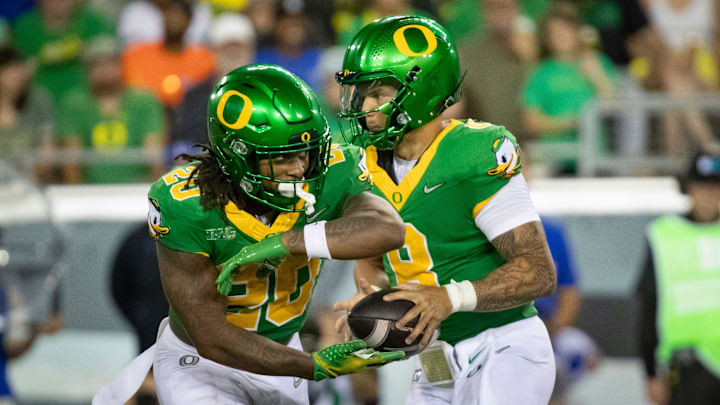 Oregon running back Jordan James takes a handoff from Oregon quarterback Dillon Gabriel as the Oregon Ducks host the Boise State Broncos Saturday, Sept. 7, 2024 at Autzen Stadium in Eugene, Ore.