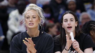Jun 7, 2025; Chicago, Illinois, USA; Injured Indiana Fever guard Sophie Cunningham (8) and guard Caitlin Clark (22) react from the bench during the first half of a WNBA game against the Chicago Sky at United Center. Mandatory Credit: Kamil Krzaczynski-Imagn Images