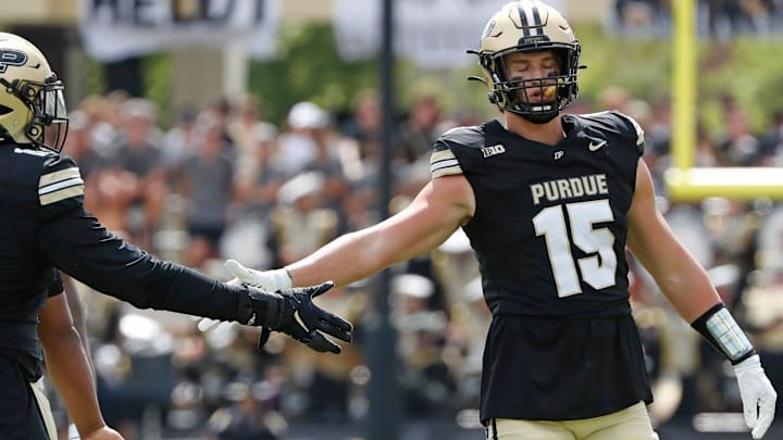 Purdue Boilermakers defensive lineman Demeco Kennedy (18) high-fives Purdue Boilermakers defensive end Will Heldt (15) Saturday, Aug. 31, 2024, during the NCAA football game against the Indiana State Sycamores at Ross-Ade Stadium in West Lafayette, Ind. Purdue Boilermakers won 49-0.