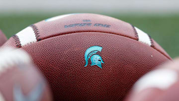 Oct 12, 2019; Madison, WI, USA; Michigan State Spartans logo on footballs during warmups prior to the game against the Wisconsin Badgers at Camp Randall Stadium. Mandatory Credit: Jeff Hanisch-Imagn Images