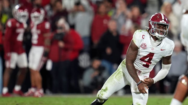 Alabama Crimson Tide quarterback Jalen Milroe (4) gets up after throwing an interception during a college football game between the University of Oklahoma Sooners (OU) and the Alabama Crimson Tide at Gaylord Family - Oklahoma Memorial Stadium in Norman, Okla., Saturday, Nov. 23, 2024. Oklahoma won 24-3.