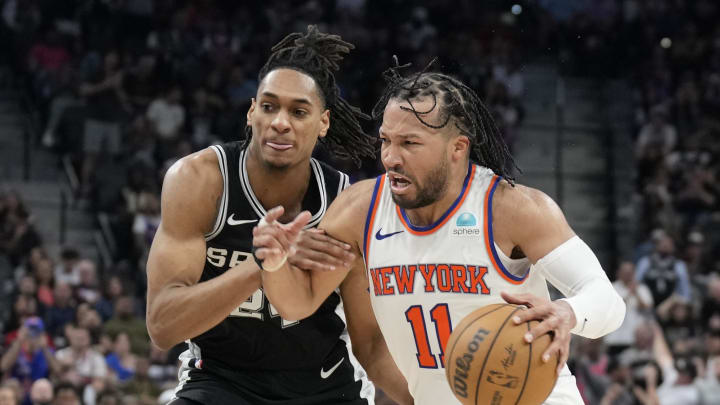 Mar 29, 2024; San Antonio, Texas, USA; New York Knicks guard Jalen Brunson (11) drives to the basket while defended by San Antonio Spurs guard Devin Vassell (24) during overtime at Frost Bank Center. Mandatory Credit: Scott Wachter-USA TODAY Sports