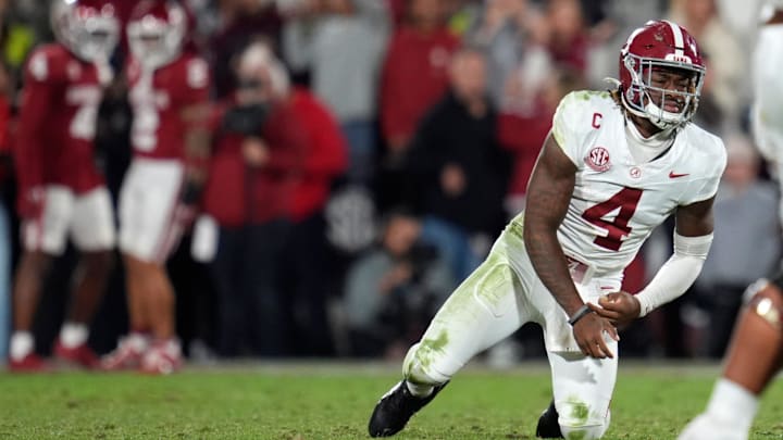 Alabama Crimson Tide quarterback Jalen Milroe (4) gets up after throwing an interception during a college football game between the University of Oklahoma Sooners (OU) and the Alabama Crimson Tide at Gaylord Family - Oklahoma Memorial Stadium in Norman, Okla., Saturday, Nov. 23, 2024. Oklahoma won 24-3.