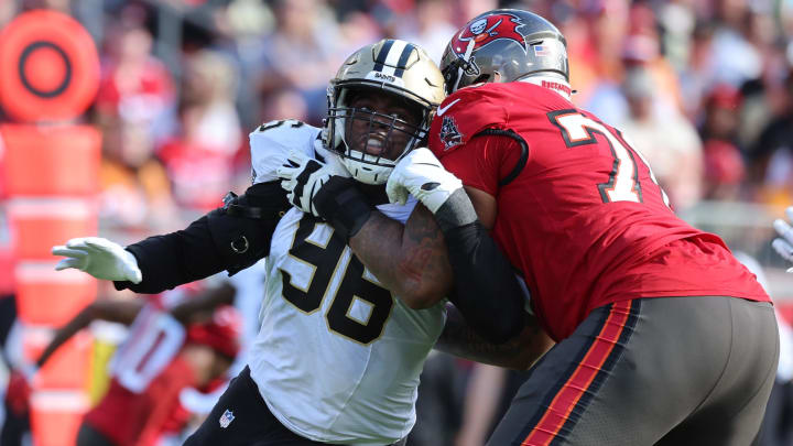 Dec 31, 2023; Tampa, Florida, USA;New Orleans Saints defensive end Carl Granderson (96) rushes as Tampa Bay Buccaneers offensive tackle Tristan Wirfs (78) blocks during the first half at Raymond James Stadium. Mandatory Credit: Kim Klement Neitzel-USA TODAY Sports