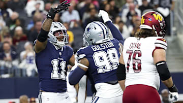 Dallas Cowboys linebacker Micah Parsons celebrates with Dallas Cowboys defensive end Chauncey Golston