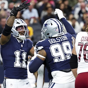 Dallas Cowboys linebacker Micah Parsons celebrates with Dallas Cowboys defensive end Chauncey Golston