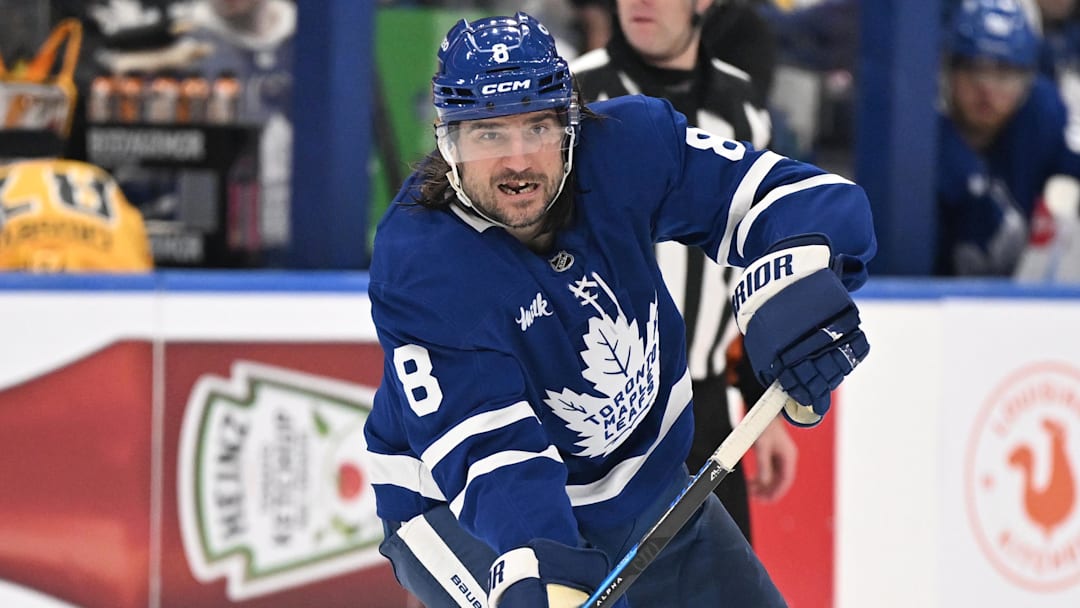 Dec 23, 2025; Toronto, Ontario, CAN;  Toronto Maple Leafs defenseman Chris Tanev (8) passes the puck against the Pittsburgh Penguins in the third period at Scotiabank Arena. Mandatory Credit: Dan Hamilton-Imagn Images