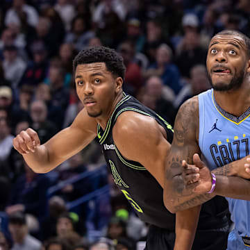 Dec 26, 2023; New Orleans, Louisiana, USA; New Orleans Pelicans forward Zion Williamson (1) and New Orleans Pelicans guard Trey Murphy III (25) hold back the Memphis Grizzlies on a free throw attempt during the second half at the Smoothie King Center. Mandatory Credit: Stephen Lew-Imagn Images