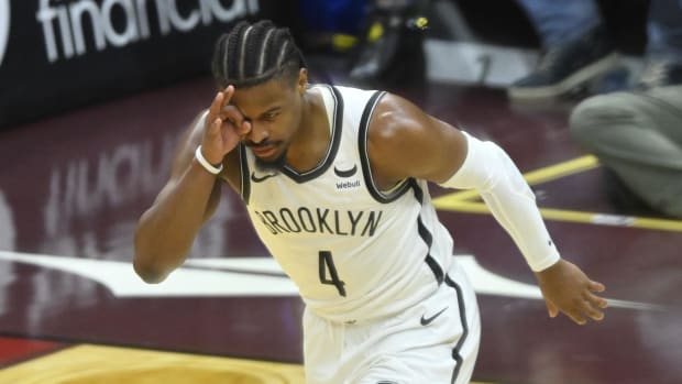 Mar 10, 2024; Cleveland, Ohio, USA; Brooklyn Nets guard Dennis Smith Jr. (4) celebrates his three-point basket in the fourth quarter against the Cleveland Cavaliers at Rocket Mortgage FieldHouse. Mandatory Credit: David Richard-USA TODAY Sports
