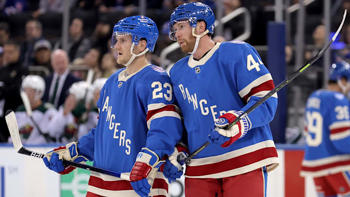 Oct 20, 2025; New York, New York, USA; New York Rangers defenseman Vladislav Gavrikov (44) talks to defenseman Adam Fox (23) during the first period against the Minnesota Wild at Madison Square Garden.