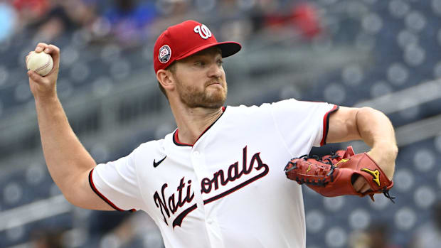 Washington Nationals starting pitcher Michael Soroka throws in a white uniform