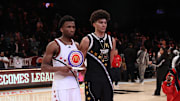 Apr 1, 2025; Brooklyn, NY, USA; McDonald's All American West guard Darryn Peterson (22) and McDonald's All American East forward Cameron Boozer (12) pose for photos after the game at Barclays Center. Mandatory Credit: Pamela Smith-Imagn Images