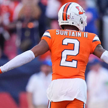 Oct 8, 2023; Denver, Colorado, USA; Denver Broncos cornerback Pat Surtain II (2) celebrates his interception with cornerback Tremon Smith (1) in the second half against the New York Jets at Empower Field at Mile High.