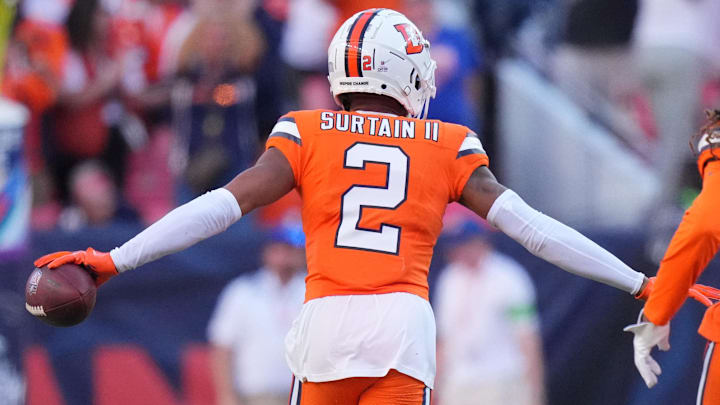 Oct 8, 2023; Denver, Colorado, USA; Denver Broncos cornerback Pat Surtain II (2) celebrates his interception with cornerback Tremon Smith (1) in the second half against the New York Jets at Empower Field at Mile High.