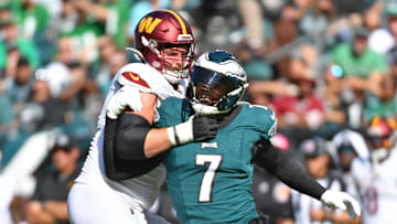 Oct 1, 2023; Philadelphia, Pennsylvania, USA; Philadelphia Eagles linebacker Haason Reddick (7) is blocked by Washington Commanders guard Andrew Wylie (71) at Lincoln Financial Field. Mandatory Credit: Eric Hartline-Imagn Images