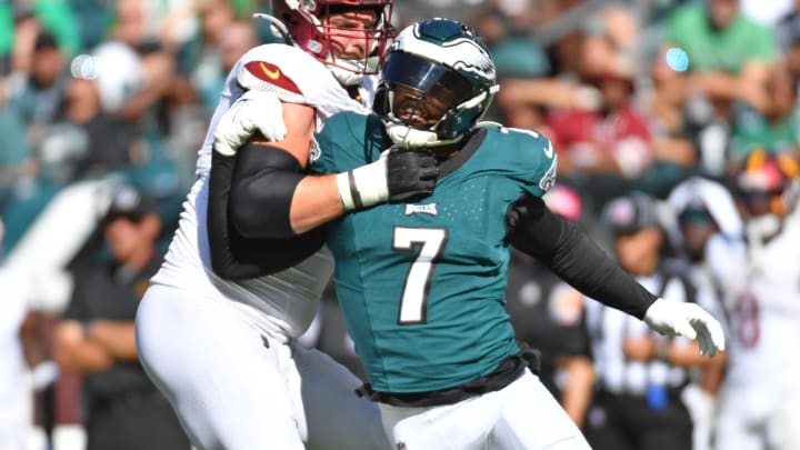 Oct 1, 2023; Philadelphia, Pennsylvania, USA; Philadelphia Eagles linebacker Haason Reddick (7) is blocked by Washington Commanders guard Andrew Wylie (71) at Lincoln Financial Field.