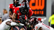 Sep 27, 2025; Raleigh, North Carolina, USA; North Carolina State Wolfpack wide receiver Terrell Anderson (9) is tackled by Virginia Tech Hokies cornerback Isaiah Brown-Murray (9), and linebacker Noah Chambers (16) during the first half of the game against Virginia Tech Hokies at Carter-Finley Stadium. Mandatory Credit: Jaylynn Nash-Imagn Images