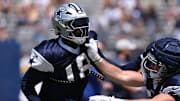 Dallas Cowboys linebacker Damone Clark tries to beat a block during training camp at the River Ridge Playing Fields in Oxnard