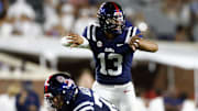 Aug 31, 2024; Oxford, Mississippi, USA; Mississippi Rebels quarterback Austin Simmons (13) gives direction prior to the snap against the Furman Paladins during the second half at Vaught-Hemingway Stadium. Mandatory Credit: Petre Thomas-Imagn Images