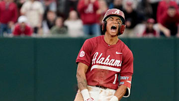 Feb 14, 2025; Tuscaloosa, AL, USA; Justin Lebron celebrates at second after hitting a three-run double during Alabama baseball’s opening day at Sewell-Thomas Stadium against Bradley. The Crimson Tide defeated Bradley 10-6.