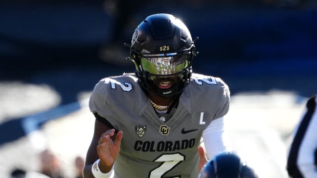 Colorado Buffaloes quarterback Shedeur Sanders (2) at the line of scrimmage. Credit: Ron Chenoy-USA TODAY Sports