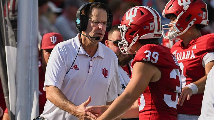 Aug 31, 2024; Bloomington, Indiana, USA;  Indiana Hoosiers Head Coach Curt Cignetti high-fives Indiana Hoosiers kicker Nicolas Radicic (39) against the Florida International Panthers during the second half at Memorial Stadium. Mandatory Credit: Robert Goddin-USA TODAY Sports