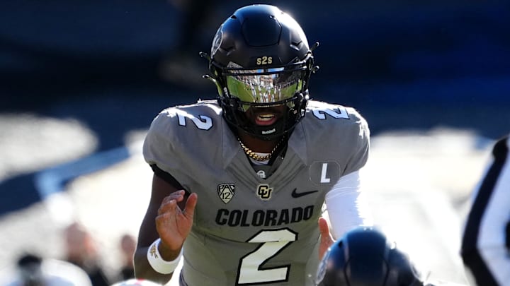 Nov 11, 2023; Boulder, Colorado, USA; Colorado Buffaloes quarterback Shedeur Sanders (2) at the line of scrimmage in the first half against the Arizona Wildcats at Folsom Field. Mandatory Credit: Ron Chenoy-Imagn Images