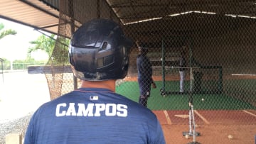 Tigers prospect Roberto Campos watches a teammate hit

Img 3106