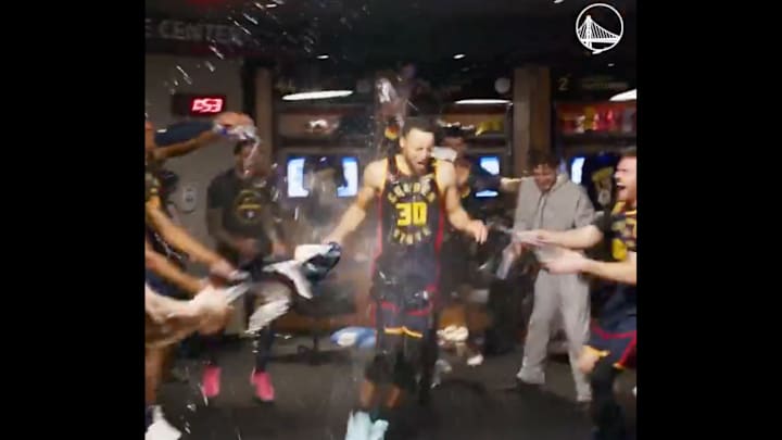 Golden State Warriors players drench Stephen Curry in water after he recorded his 4,000th three-point shot on March 13, 2025.