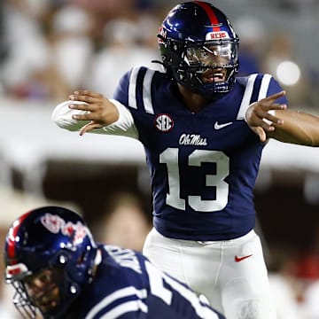 Aug 31, 2024; Oxford, Mississippi, USA; Mississippi Rebels quarterback Austin Simmons (13) gives direction prior to the snap against the Furman Paladins during the second half at Vaught-Hemingway Stadium. Mandatory Credit: Petre Thomas-Imagn Images