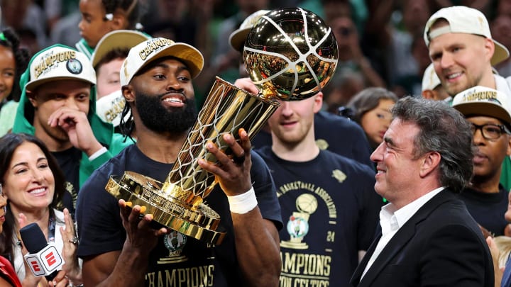 Jun 17, 2024; Boston, Massachusetts, USA; Boston Celtics guard Jaylen Brown (7) celebrates with the Larry O’Brien Trophy after beating the Dallas Mavericks in game five of the 2024 NBA Finals to win the NBA Championship at TD Garden. Mandatory Credit: Peter Casey-USA TODAY Sports