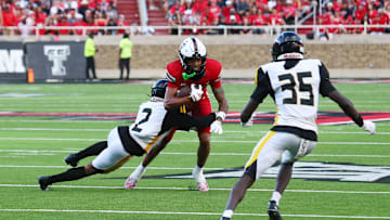 Aug 30, 2025; Lubbock, Texas, USA;  Texas Tech Red Raiders wide receiver Reggie Virgil (1) rushes against Arkansas-Pine Bluff Golden Lions defensive back Kristian Gammage (2) in the first half at Jones AT&T Stadium. Mandatory Credit: Michael C. Johnson-Imagn Images