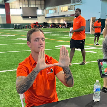 Carson Beck Holding Up the U during Miami's Fall Camp Media Day