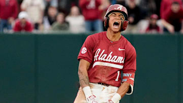 Feb 14, 2025; Tuscaloosa, AL, USA; Justin Lebron celebrates at second after hitting a three-run double during Alabama baseball’s opening day at Sewell-Thomas Stadium against Bradley. The Crimson Tide defeated Bradley 10-6.