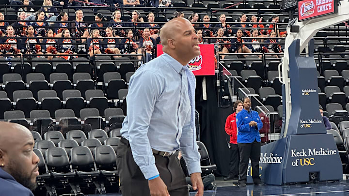 Loyola basketball coach Damaine Powell yells to his team while they play at the Intuit Dome. Loyola basketball coach Damaine Powell yells to his team while they play at the Intuit Dome.