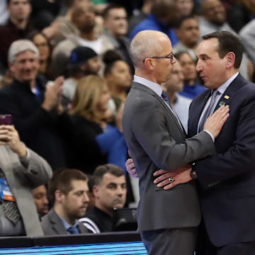 Mar 17, 2018; Pittsburgh, PA, USA; Rhode Island Rams head coach Dan Hurley talks with Duke Blue Devils head coach Mike Krzyzewski after being defeated in the second round of the 2018 NCAA Tournament at PPG Paints Arena. Mandatory Credit: Geoff Burke-Imagn Images